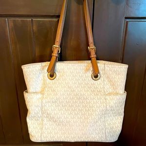 Michael Kors shoulder Purse! Lightly used. Cream with brown/tan accents.